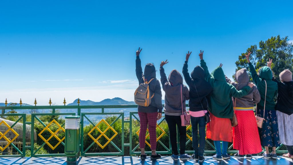 a picture of group of girls enjoying the mountain view from the Doddabeta View Point at Ooty, Tamil Nadu.